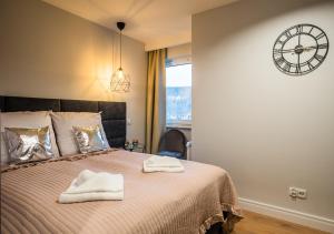 Posteľ alebo postele v izbe v ubytovaní Apartament A7