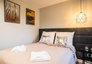 Posteľ alebo postele v izbe v ubytovaní Apartament A7