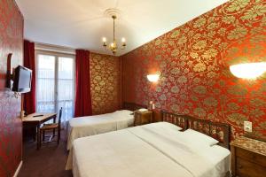 Postel nebo postele na pokoji v ubytování Hotel Du Nord