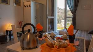 a tea kettle on a table in a kitchen at Agriturismo Orto dei Rolli in Moneglia