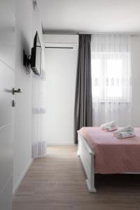 Postel nebo postele na pokoji v ubytování Apartment Second Ivana