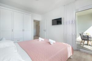Postel nebo postele na pokoji v ubytování Apartment Second Ivana