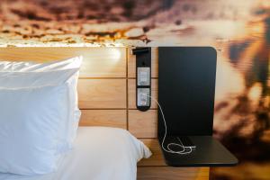 Cama ou camas em um quarto em Novotel Curitiba Batel
