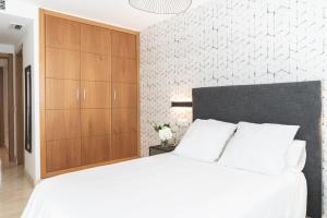 Posteľ alebo postele v izbe v ubytovaní Pacificio Beachfront