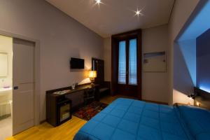 Postel nebo postele na pokoji v ubytování Liddo Boutique hotel