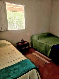 Giường trong phòng chung tại Espaço Terra Dourada, Ibicoara, Chap Diamantina