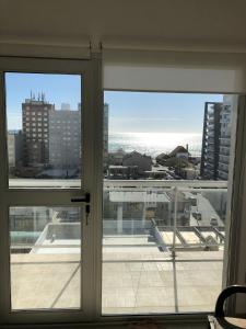 a view of a city from a window at Departamento Centrico VDL in Puerto Madryn