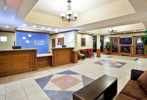 a lobby of a hospital with a waiting room at Holiday Inn Express Hotel & Suites Howell, an IHG Hotel in Howell