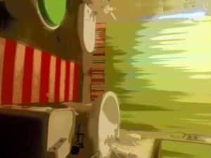 a painting of a bathroom with a toilet at Su Planu in Cagliari
