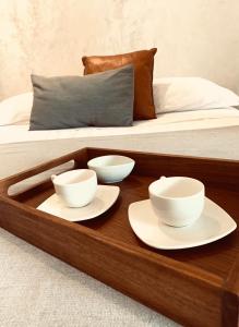 Apartments & Suites MADRE Holbox Self-Check IN客房内的一张或多张床位