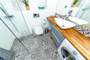 Koupelna v ubytování Bright - Neptun Park by OneApartments