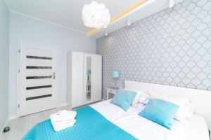 Postel nebo postele na pokoji v ubytování Bright - Neptun Park by OneApartments