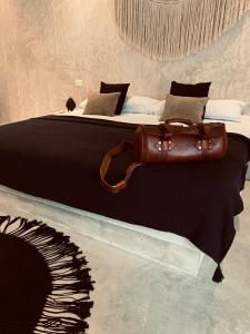 Apartments & Suites MADRE Holbox Self-Check IN客房内的一张或多张床位