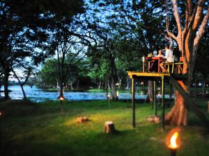 
a picnic table with a fire hydrant on top of it at Cinnamon Lodge Habarana in Habarana
