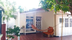 a hammock in the front of a house at HABITACION PRIVADA EN CASA DE MIS PADRES in Barranquilla