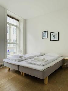 Postel nebo postele na pokoji v ubytování ApartmentInCopenhagen Apartment 451