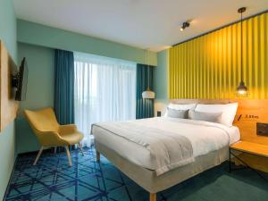 Postel nebo postele na pokoji v ubytování ibis Styles Bucharest Erbas + 37 fotografií
