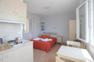 Letto o letti in una camera di Aigaio Studios tinos