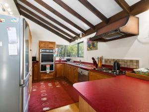 A kitchen or kitchenette at Lakeside Hideaway - Lake Rotoiti Holiday Home