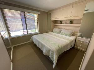 A bed or beds in a room at The Quiet Family Getaway