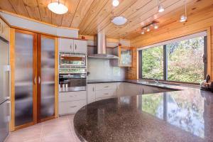 A kitchen or kitchenette at Lakeside Landing - Lake Tarawera Holiday Home