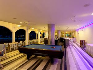 a billiard room with a pool table and a bar at Trinco Blu by Cinnamon in Trincomalee