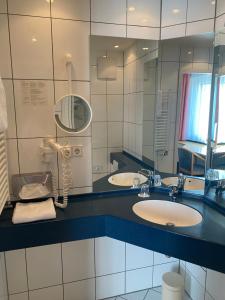 Vannituba majutusasutuses Mirage City Hotel Stuttgart Zentrum