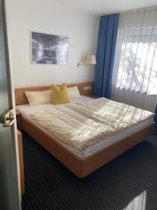 Voodi või voodid majutusasutuse Mirage City Hotel Stuttgart Zentrum toas