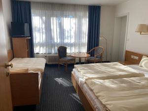 Voodi või voodid majutusasutuse Mirage City Hotel Stuttgart Zentrum toas