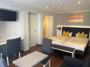 Voodi või voodid majutusasutuse Mirage City Hotel Stuttgart Zentrum toas