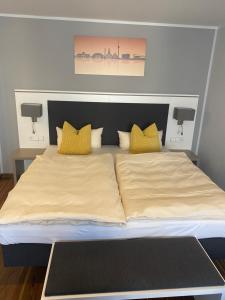 Voodi või voodid majutusasutuse Mirage City Hotel Stuttgart Zentrum toas