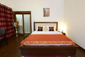 Postel nebo postele na pokoji v ubytování Golden Homestay