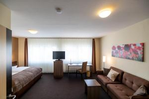 TV a/nebo společenská místnost v ubytování Hotel Germania