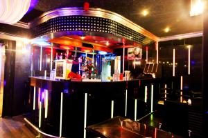 a bar in a room with aperature at Gulf Inn Hotel Deira Formerly City Star Hotel in Dubai +24 photos