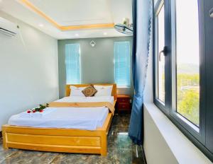 Postel nebo postele na pokoji v ubytování Gao Hotel