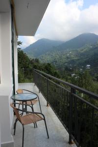 Balcone o terrazza di Белый дом в горах, утопающий в зелени