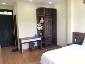 Voodi või voodid majutusasutuse Ngoc Tran Hotel toas