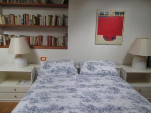 Letto o letti in una camera di B&B Le Ortensie
