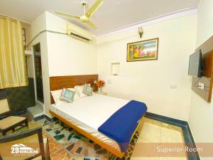 a bedroom with a bed and a ceiling fan at 5BR Rajkarn Boutique Villa by 29Bungalow in Udaipur +14 photos