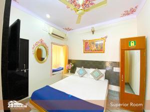 a bedroom with a bed and a ceiling at 5BR Rajkarn Boutique Villa by 29Bungalow in Udaipur