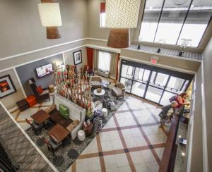 a living room filled with lots of furniture at Holiday Inn Express Hotel & Suites - Atlanta/Emory University Area, an IHG Hotel in Decatur