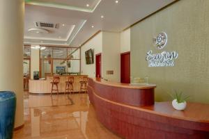 a lobby of a salon with a counter and chairs at Season Paradise in Thulusdhoo