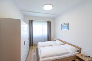 Łóżko lub łóżka w pokoju w obiekcie Appartement Graz - Ihr erstklassiges Zuhause fernab von Zuhause