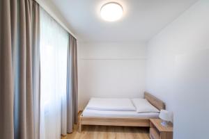 Łóżko lub łóżka w pokoju w obiekcie Appartement Graz - Ihr erstklassiges Zuhause fernab von Zuhause
