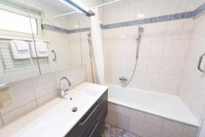 Łazienka w obiekcie Appartement Graz - Ihr erstklassiges Zuhause fernab von Zuhause