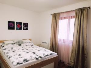 Postel nebo postele na pokoji v ubytování Napvirág Vendégház