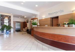 a lobby of a hospital with a reception counter at Rezydencja Bielik in Międzyzdroje +63 photos