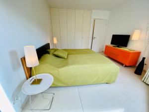 מיטה או מיטות בחדר ב-Villa Seepark - Ferienwohnung 7