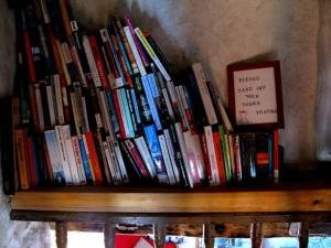 a book shelf filled with lots of books at Abella Climb Eco Refugio Permanent Closure in Abella de la Conca