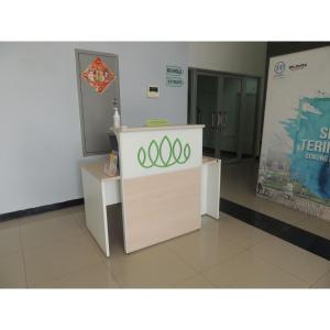 a kiosk with olympics signs on it in a room at Reva Room on Gunung Putri Square Apartment in Bogor